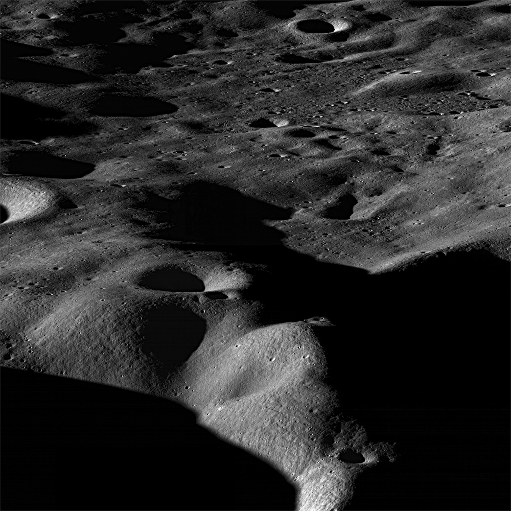 Oblique view across the shadowed, cratered terrain near the Moon's Cabeus crater
